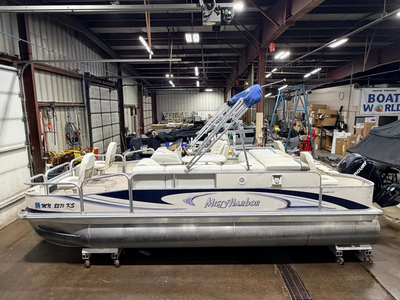 Slide: The Image of 2010 Misty Harbor pontoon boat in warehouse, model 2085DF, 50HP Mercury4Stroke. - 3