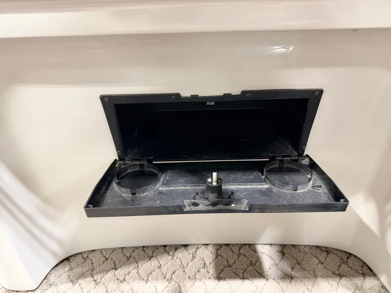 Slide: The Image of Open storage compartment on a 2010 Misty Harbor boat. - 31