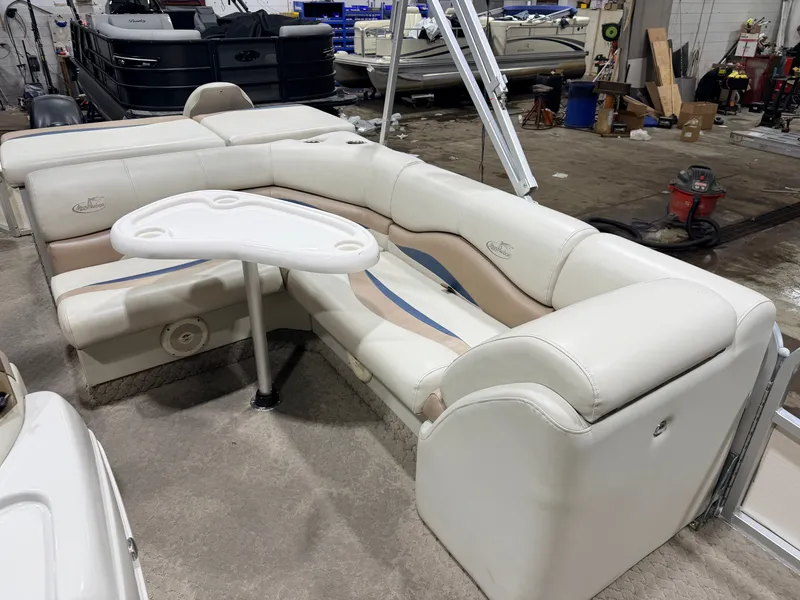 Slide: The Image of 2010 Misty Harbor pontoon boat with seating area and table. - 35