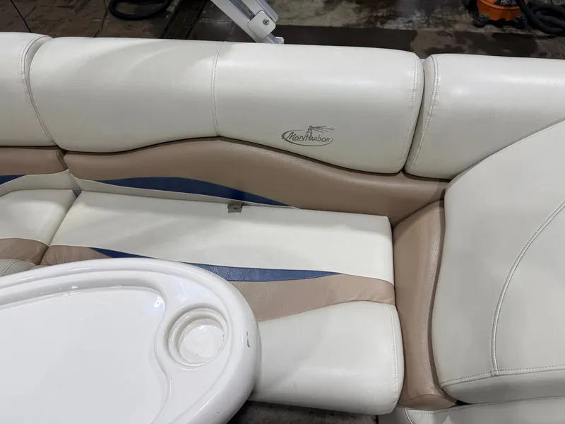 Slide: The Image of Interior of 2010 Misty Harbor pontoon boat with beige and blue upholstery. - 38