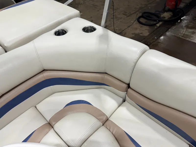 Slide: The Image of Corner seating of a 2010 Misty Harbor pontoon boat with cup holders. - 39
