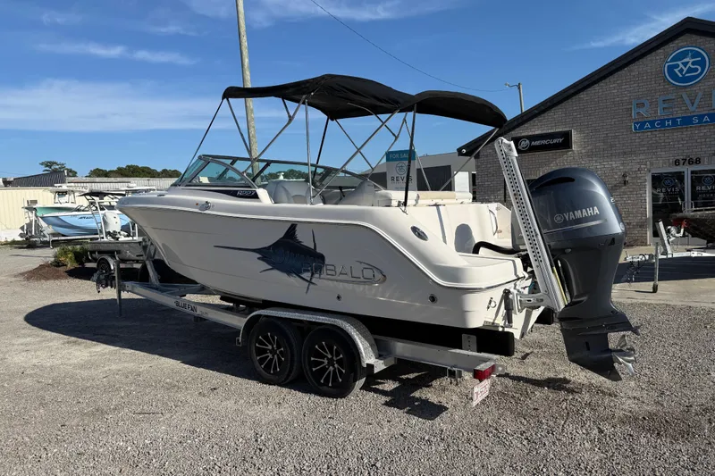 Slide: The Image of 2015 Robalo R227 Dual Console boat on trailer with Yamaha outboard motor. - 3