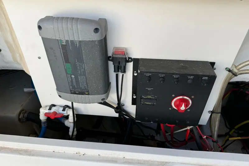 Slide: The Image of 2015 Robalo R227 Dual Console boat electrical panel and battery charger setup. - 37