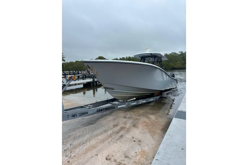 The Image of 2024 Yellowfin 36 Offshore boat on trailer at dockside. - 14