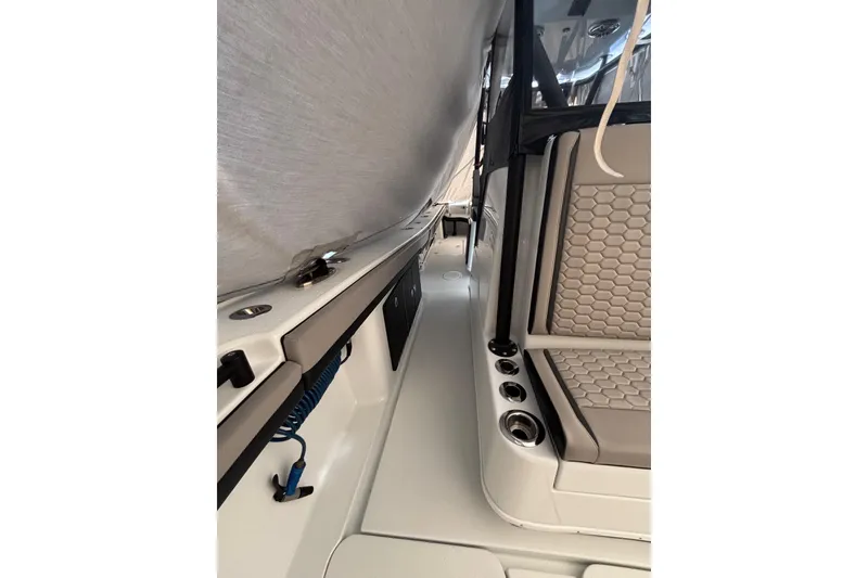 Slide: The Image of 2024 Yellowfin 36 Offshore boat interior with seating and storage compartments. - 21
