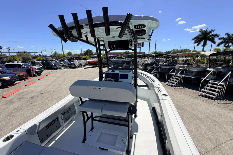 Slide: The Image of 2026 Sea Pro 225FLX Sandbar boat at dealership, featuring modern design and equipment. - 13