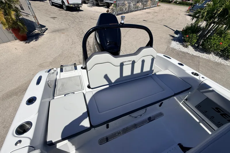 Slide: The Image of 2026 Sea Pro 225FLX Sandbar boat interior with seating and storage. - 14