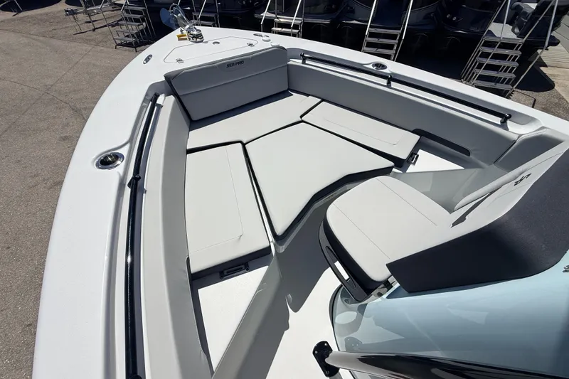 Slide: The Image of 2026 Sea Pro 225FLX Sandbar boat interior with cushioned seating and sleek design. - 19
