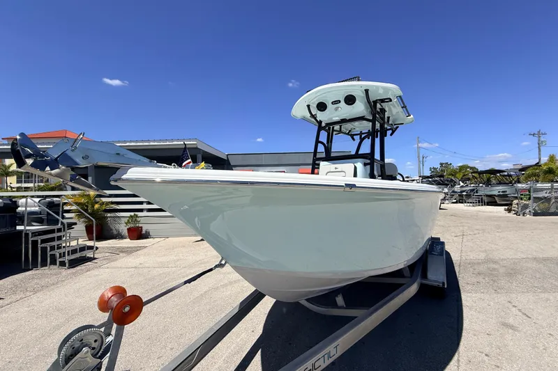 Slide: The Image of 2026 Sea Pro 225FLX Sandbar boat on trailer under clear blue sky. - 3