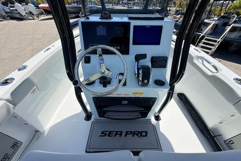 Slide: The Image of 2026 Sea Pro 225FLX Sandbar boat dashboard with steering wheel and controls. - 30