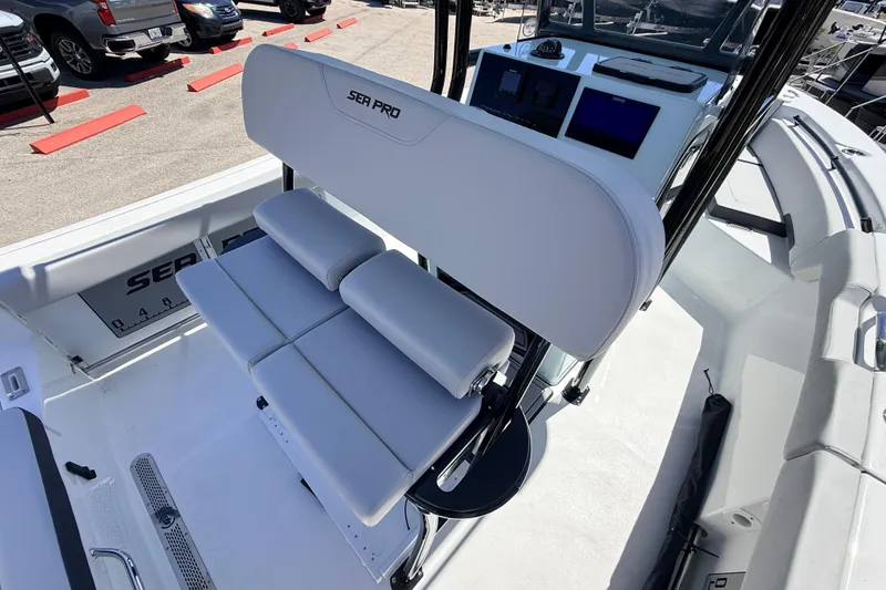 Slide: The Image of 2026 Sea Pro 225FLX Sandbar boat interior with white seating and modern dashboard. - 35