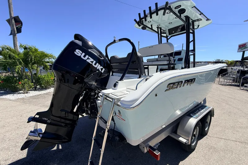 Slide: The Image of 2026 Sea Pro 225FLX Sandbar boat with Suzuki outboard motor on trailer. - 7