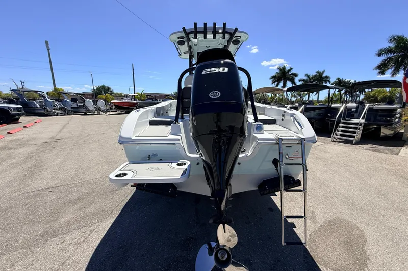 Slide: The Image of 2026 Sea Pro 225FLX Sandbar boat with powerful outboard motor in a sunny marina. - 9