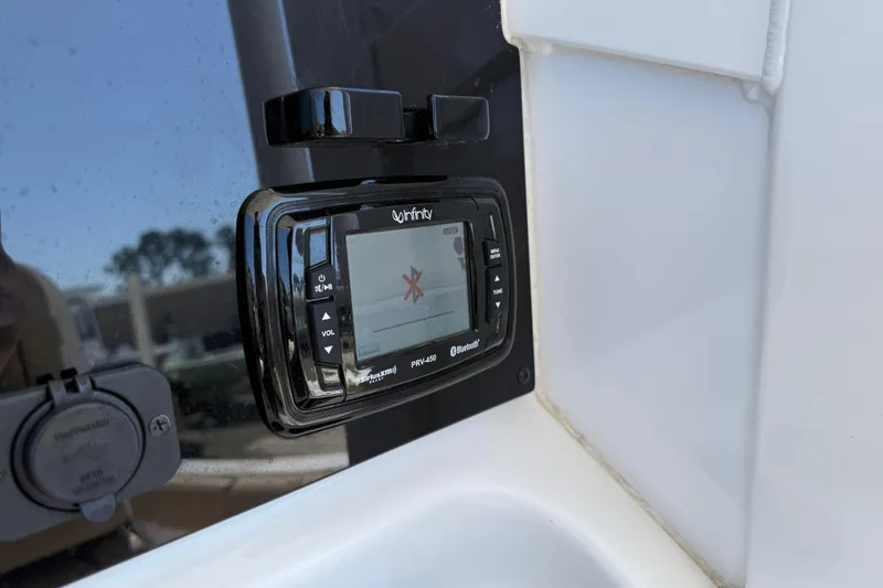 Slide: The Image of Infinity PRV-450 Bluetooth stereo on 2018 Sea Hunt Ultra 235 SE boat dashboard. - 20