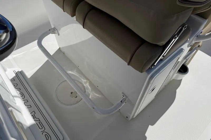 Slide: The Image of 2018 Sea Hunt Ultra 235 SE boat interior with seating and footrest. - 26