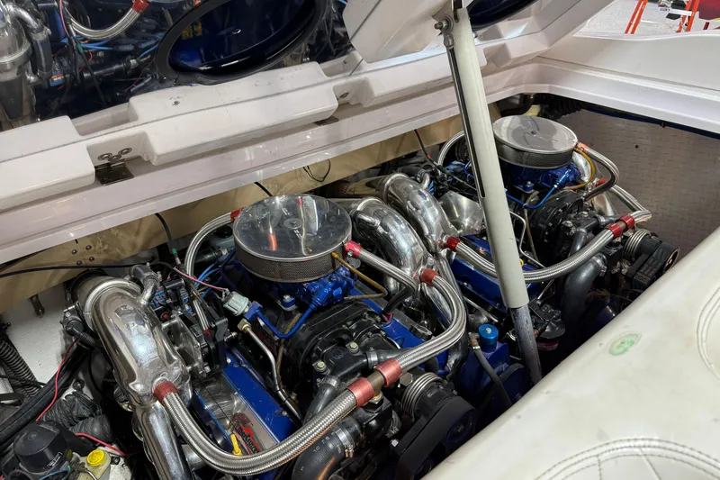 Slide: The Image of Twin engines in a 1998 Donzi 38 ZX boat, showcasing intricate mechanical details. - 14