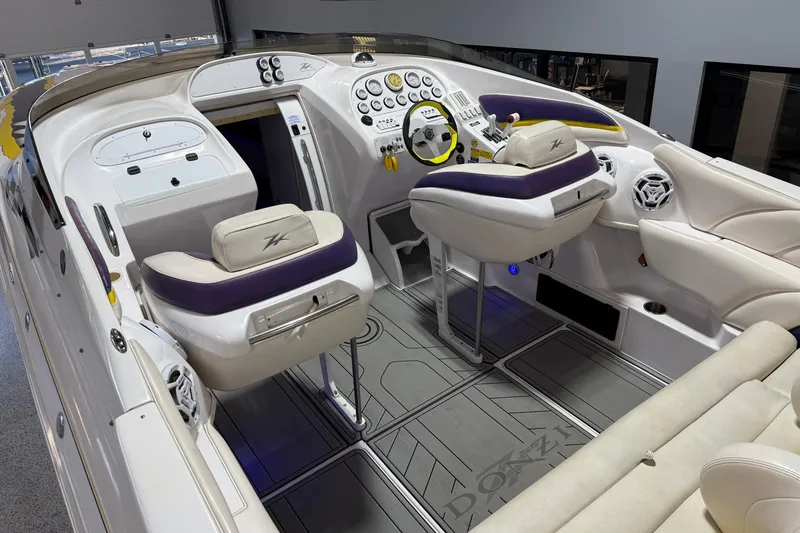 Slide: The Image of Interior of a 1998 Donzi 38 ZX boat with modern controls and seating. - 19