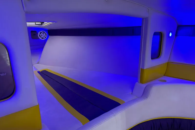 Slide: The Image of Interior of a 1998 Donzi 38 ZX boat with blue ambient lighting. - 25
