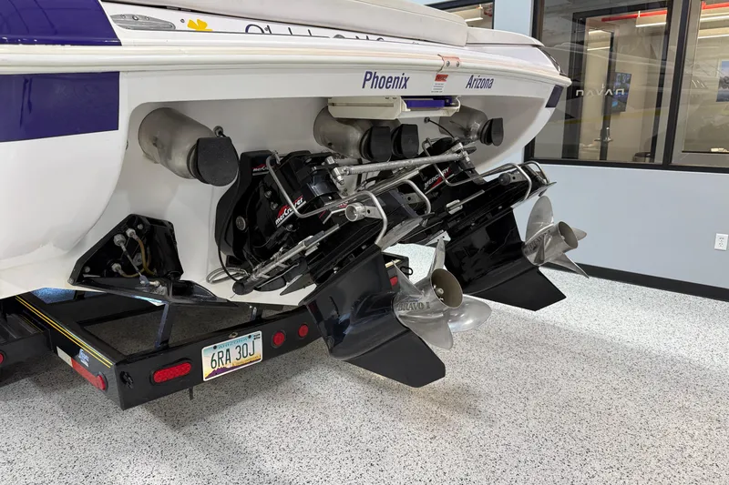 Slide: The Image of 1998 Donzi 38 ZX boat with dual propellers and Arizona license plate in a showroom. - 4