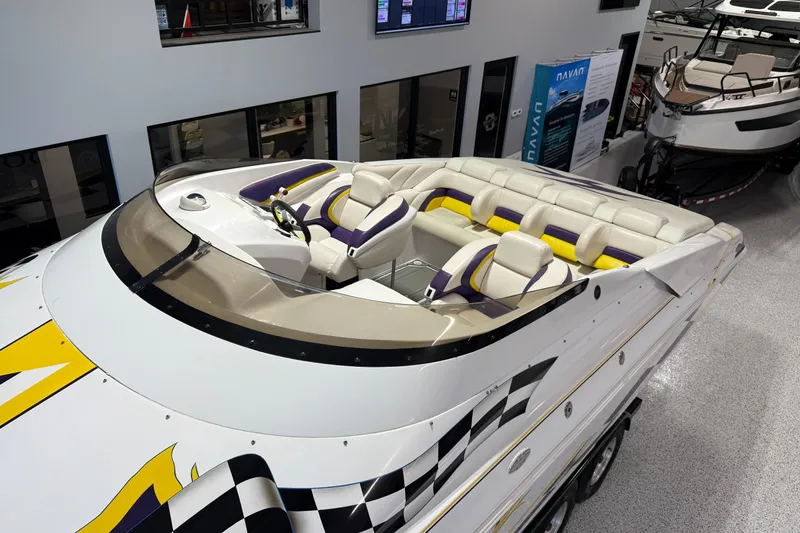 Slide: The Image of 1998 Donzi 38 ZX speedboat with vibrant interior, showcased indoors. - 8