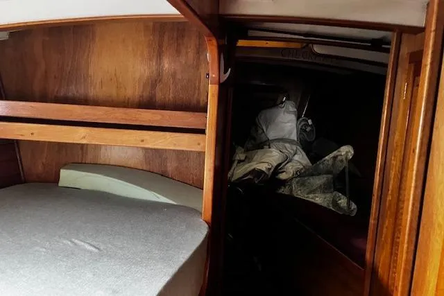 Slide: The Image of Queen bed, V-berth area has one berth on starboard, port area is for storage - 8