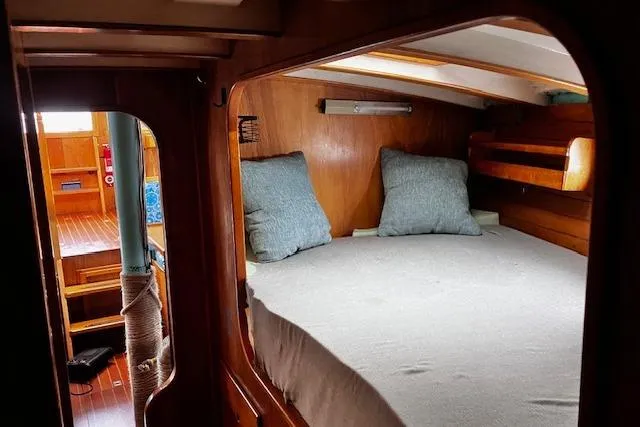 Slide: The Image of Cozy cabin interior of 1984 Swanson 42' Cutter sailboat with wooden finish. - 9