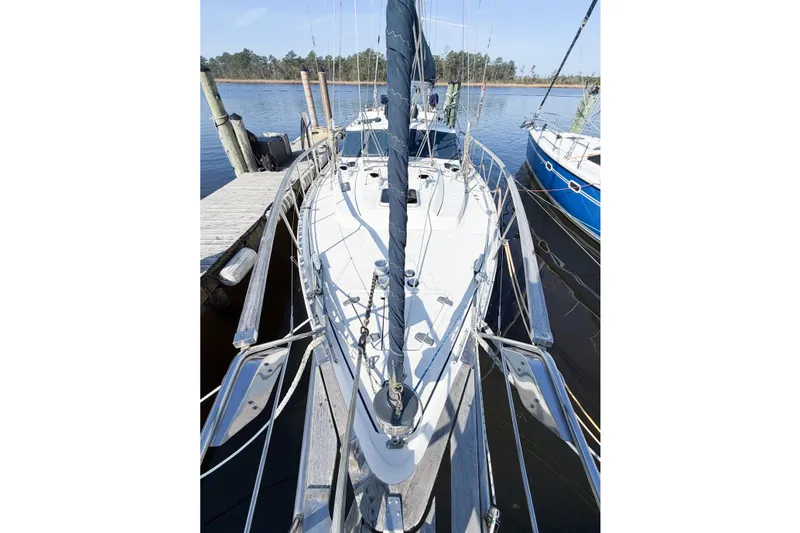 Slide: The Image of 1986 Nauticat 40 sailboat docked at marina, viewed from above. - 10