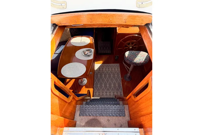 Slide: The Image of Interior view of 1986 Nauticat 40 sailboat with wooden finishes and seating area. - 25