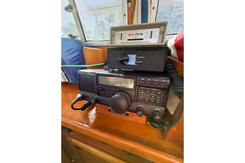 Slide: The Image of Radio equipment on 1986 Nauticat 40 sailboat, featuring communication and navigation devices. - 39