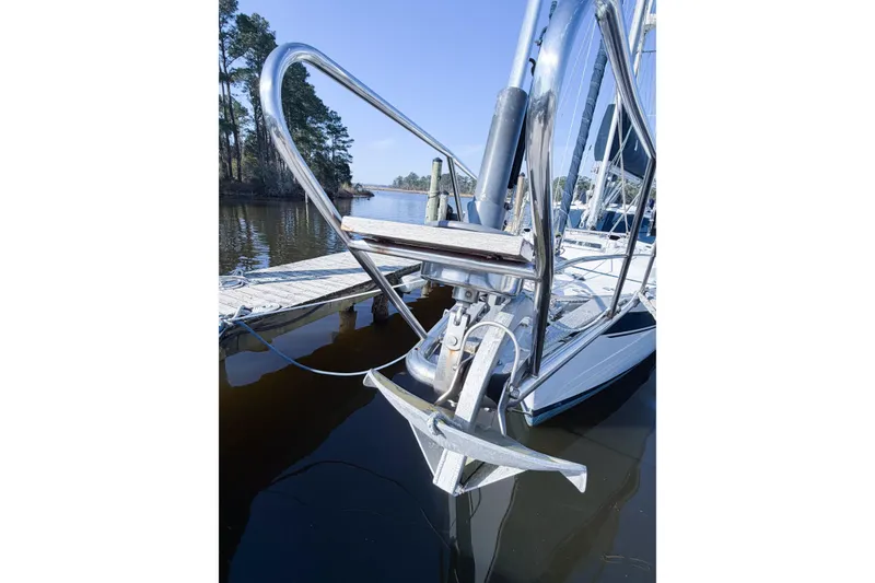 Slide: The Image of 1986 Nauticat 40 sailboat anchored at a dock, featuring a polished metal bow. - 5
