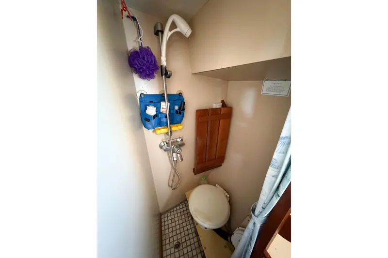 Slide: The Image of Compact bathroom with shower and toilet on a 1986 Nauticat 40 sailboat. - 54