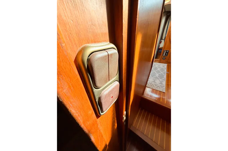Slide: The Image of Wooden interior of 1986 Nauticat 40 yacht with light switches. - 57