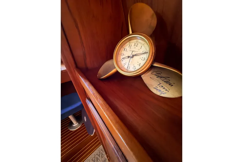 Slide: The Image of Vintage clock on Nauticat 40 yacht, 1986 model, with wooden interior and propeller decoration. - 58