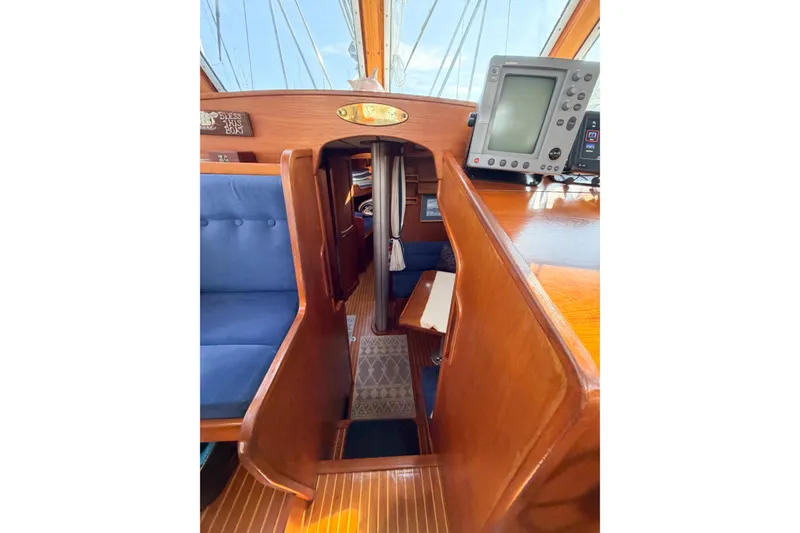 Slide: The Image of Interior of 1986 Nauticat 40 sailboat with wooden finish and navigation equipment. - 61