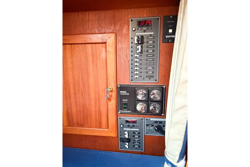Slide: The Image of Control panel of a 1986 Nauticat 40 sailboat with gauges and switches. - 89