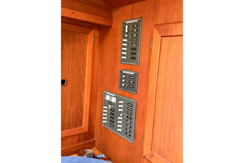 Slide: The Image of Electrical panel on 1986 Nauticat 40 sailboat with wooden interior. - 90