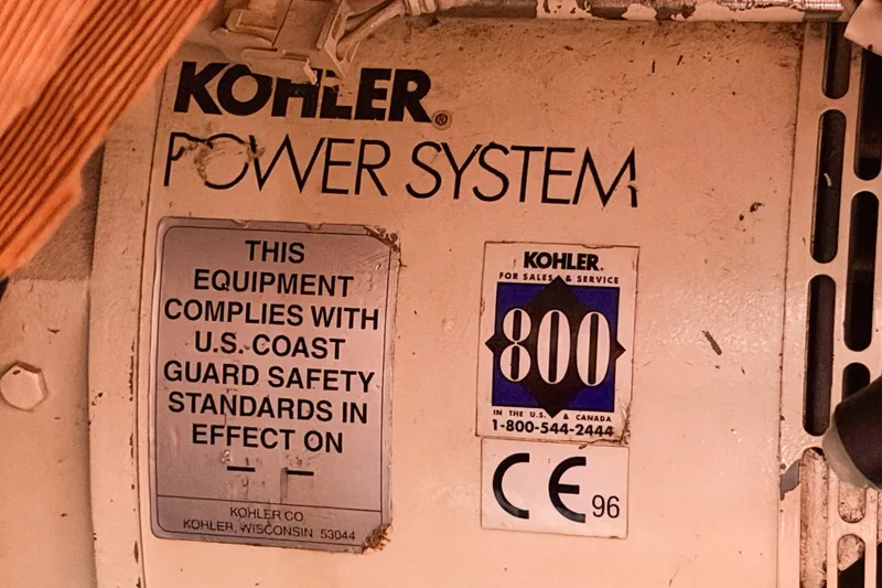 Slide: The Image of Kohler power system label on 1986 Nauticat 40, showing compliance with U.S. Coast Guard standards. - 94
