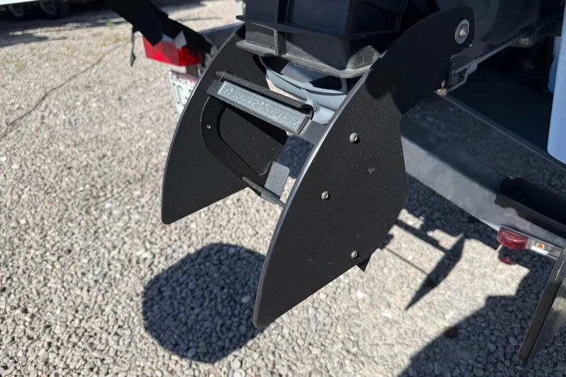 Slide: The Image of 2024 Yamaha Boats AR220 jet propulsion system detail on gravel surface. - 10