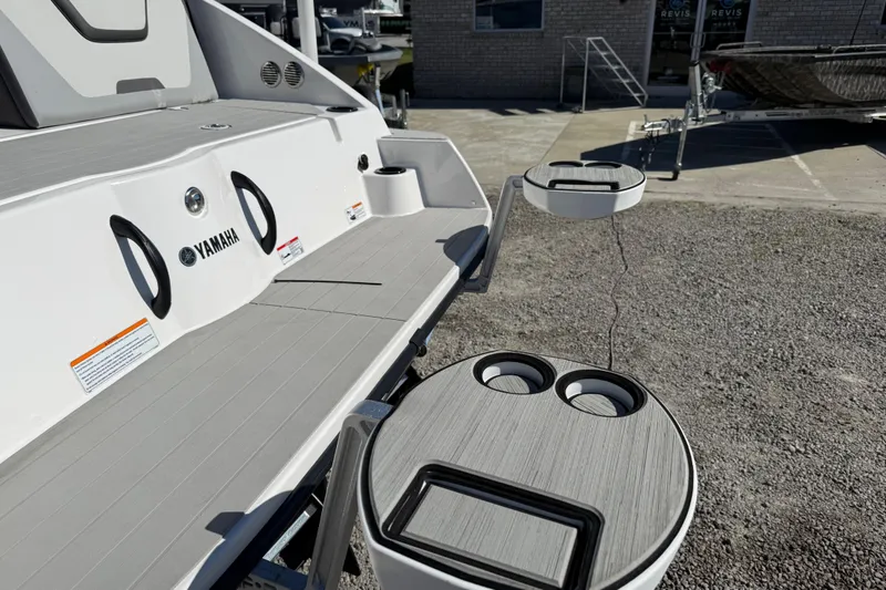 Slide: The Image of 2024 Yamaha Boats AR220 swim platform with cup holders and sleek design. - 18