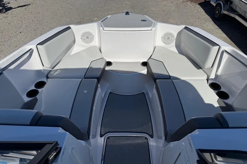 Slide: The Image of 2024 Yamaha Boats AR220 interior with spacious seating and cup holders. - 19