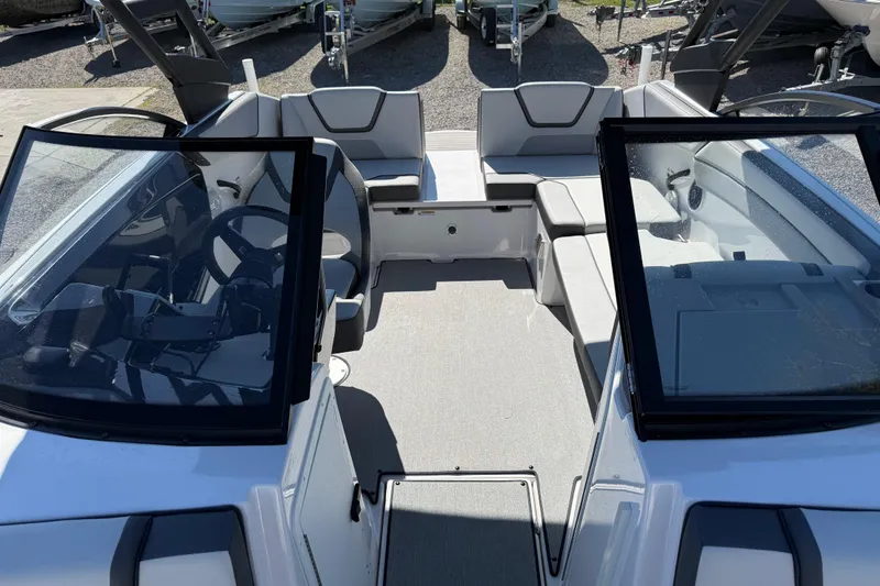 Slide: The Image of 2024 Yamaha Boats AR220 interior with seating and steering wheel, showcasing modern design. - 23