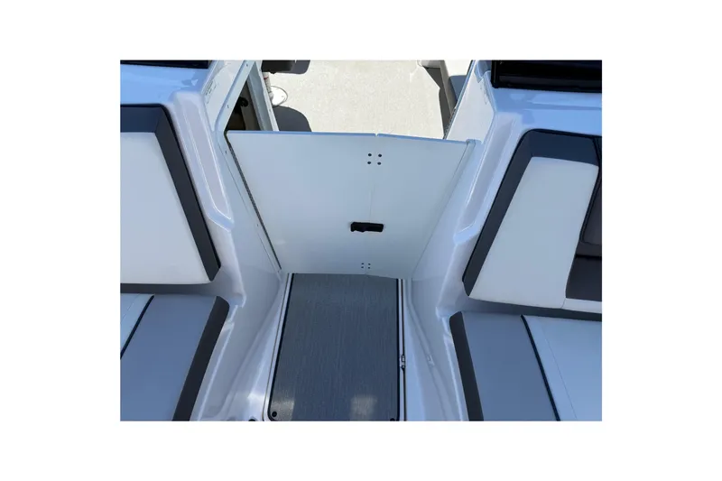 Slide: The Image of 2024 Yamaha Boats AR220 interior seating and deck view. - 24