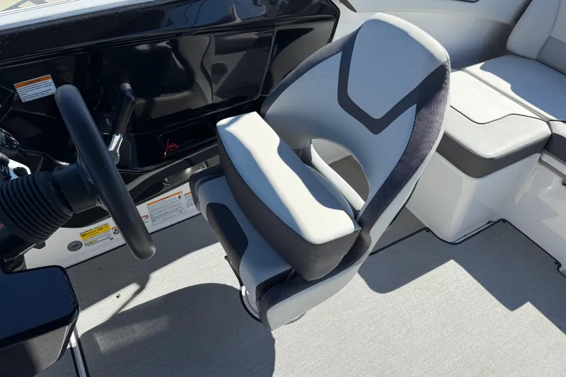 Slide: The Image of 2024 Yamaha Boats AR220 cockpit with modern steering and comfortable seating. - 33