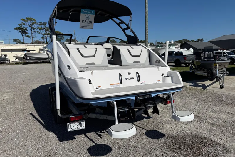 Slide: The Image of 2024 Yamaha Boats AR220 for sale, displayed in a boat dealership lot. - 5