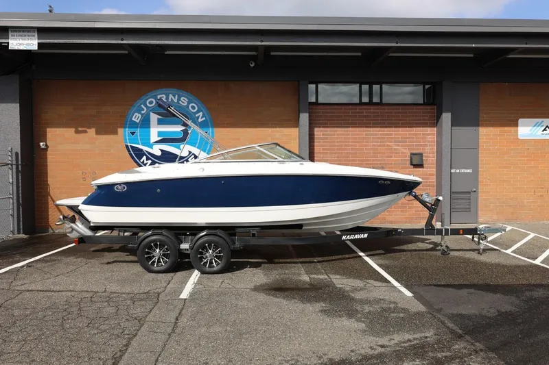 The Image of 2005 Cobalt 200 boat on trailer, parked outside Bjornson Marine building. - 1