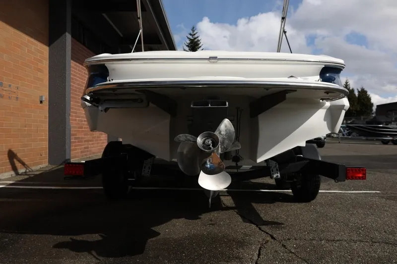 Slide: The Image of Rear view of a 2005 Cobalt 200 boat on a trailer, showcasing the propeller. - 12