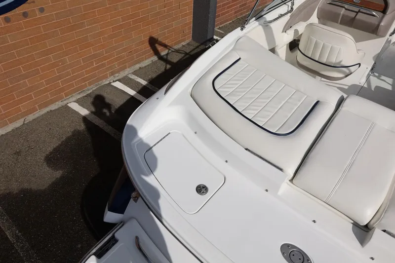 Slide: The Image of White Cobalt 200 boat interior, 2005 model, parked near a brick wall. - 17