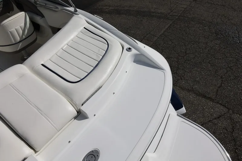 Slide: The Image of 2005 Cobalt 200 boat interior with white leather seating and sleek design. - 18
