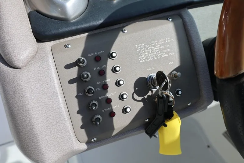 Slide: The Image of Control panel of a 2005 Cobalt 200 boat with ignition keys and switches. - 25
