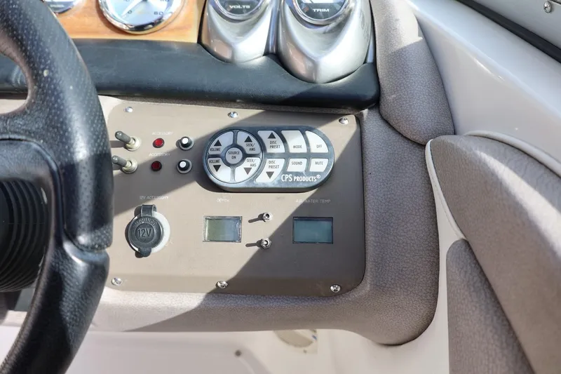 Slide: The Image of Dashboard controls of a 2005 Cobalt 200 boat, featuring gauges and accessory switches. - 26